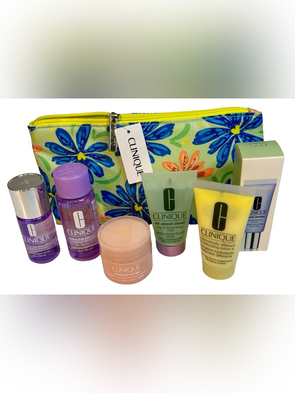 Clinique travel skincare set with blue floral pouch and yellow accents